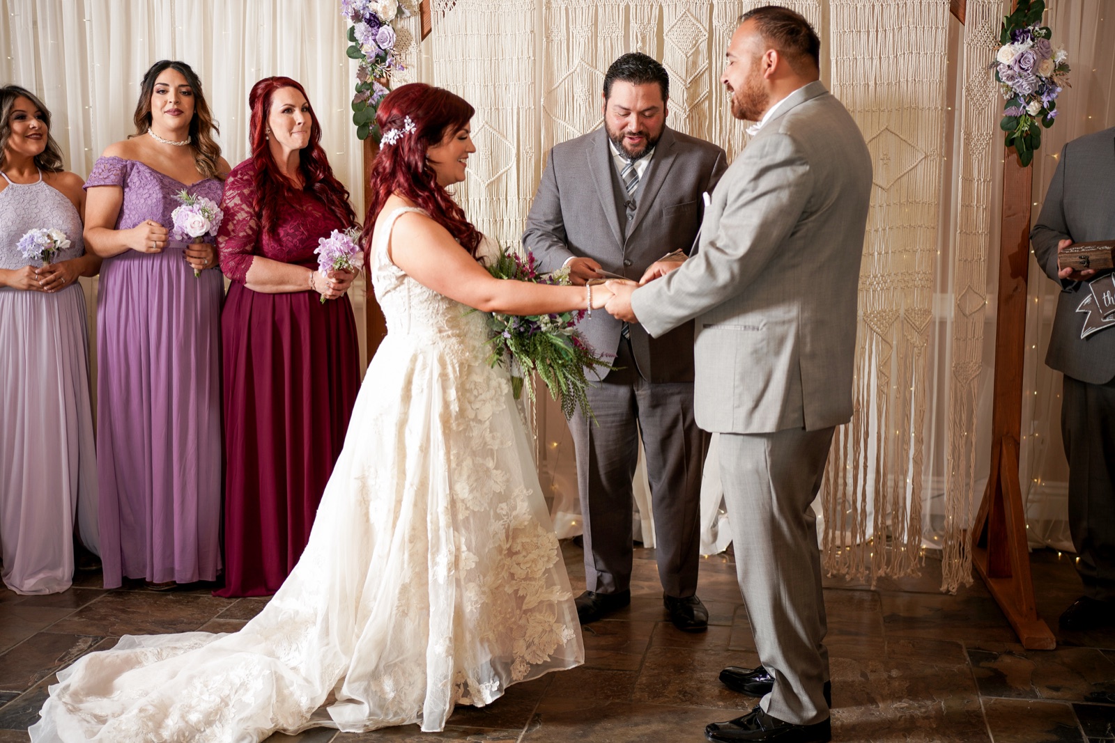 Bride and groom exchanging vows during an indoor wedding ceremony